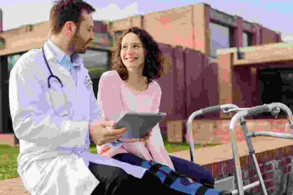 A doctor and patient sitting on the side of a road.