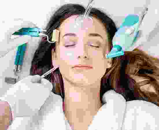 blog-detail-5 A woman getting her face waxed by two hands.